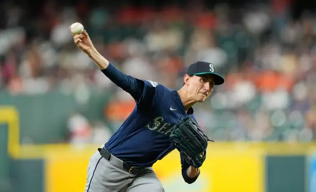 Seattle Mariners starting pitcher George Kirby throws against the Houston Astros during the first inning of a baseball game Friday, Aug. 14, 2026, in Houston. (AP Photo/David J. Phillip)