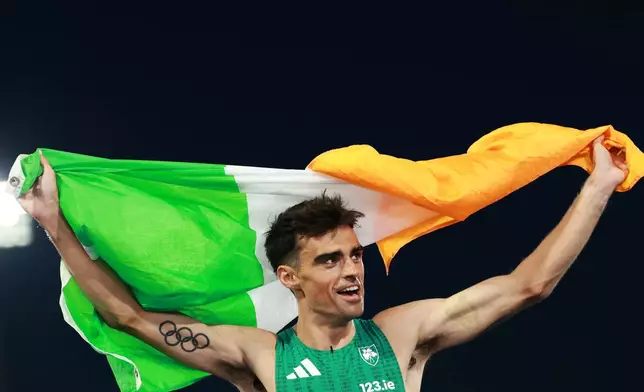 Ireland's Andrew Coscoran celebrates winning the bronze medal in the men's 1,500 meters final at the European Athletics Championships in Birmingham, England, Saturday, Aug. 15, 2026. (AP Photo/Morgan Harlow)