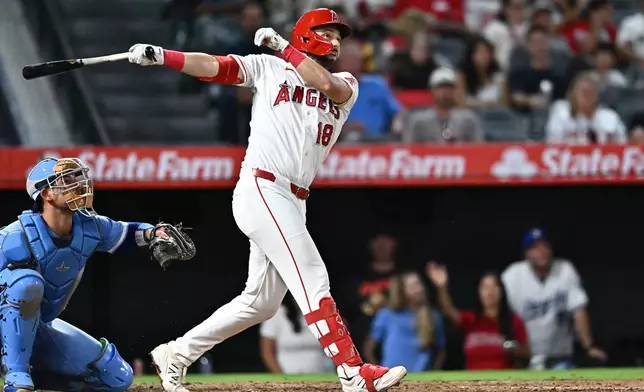 Los Angeles Angels' Nolan Schanuel hits a single during the sixth inning of a baseball game against the Kansas City Royals, Saturday, Aug. 15, 2026, in Anaheim, Calif. (AP Photo/William Liang)