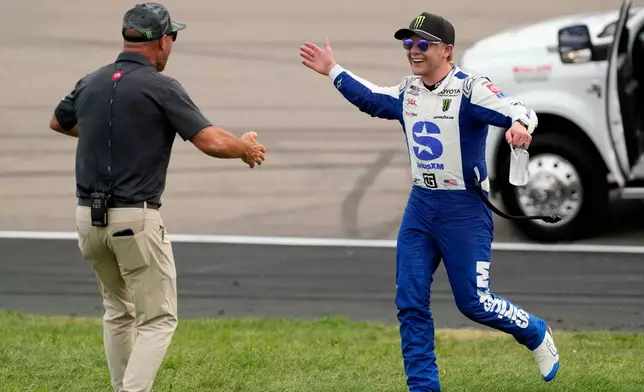 Ty Gibbs celebrates after winning a NASCAR Cup Series auto race, Sunday, Aug. 9, 2026, at Iowa Speedway in Newton, Iowa. (AP Photo/Charlie Neibergall)