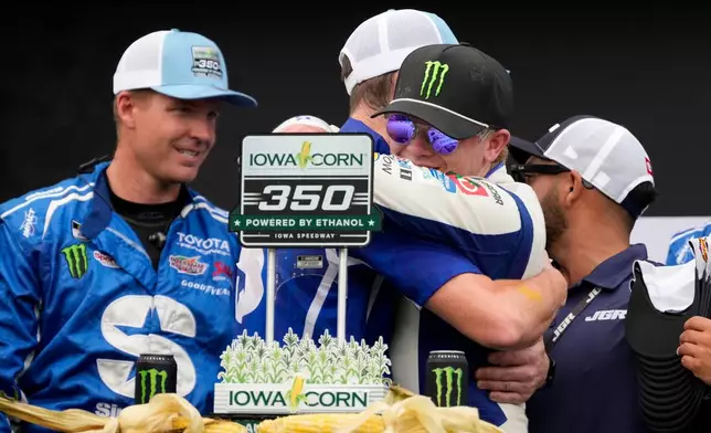 Ty Gibbs celebrates with crew members after winning a NASCAR Cup Series auto race, Sunday, Aug. 9, 2026, at Iowa Speedway in Newton, Iowa. (AP Photo/Charlie Neibergall)