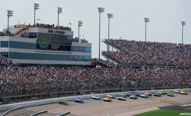 Ryan Blaney leads the field at the start of a NASCAR Cup Series auto race, Sunday, Aug. 9, 2026, at Iowa Speedway in Newton, Iowa. (AP Photo/Charlie Neibergall)