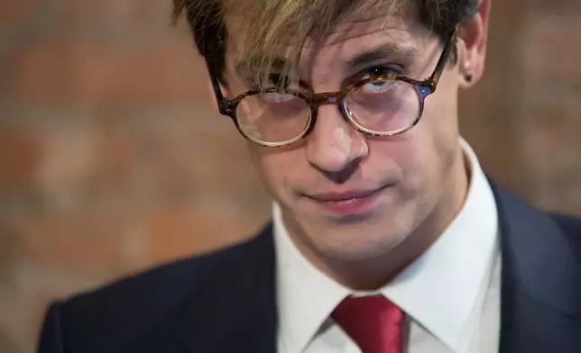FILE - Milo Yiannopoulos pauses while speaking during a news conference in New York, Feb. 21, 2017. (AP Photo/Mary Altaffer, File)