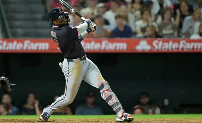 Cleveland Guardians' Jo Adell singles in a run during the fifth inning of a baseball game against the Los Angeles Angels, Monday, Aug. 24, 2026, in Anaheim, Calif. (AP Photo/Jayne Kamin-Oncea)