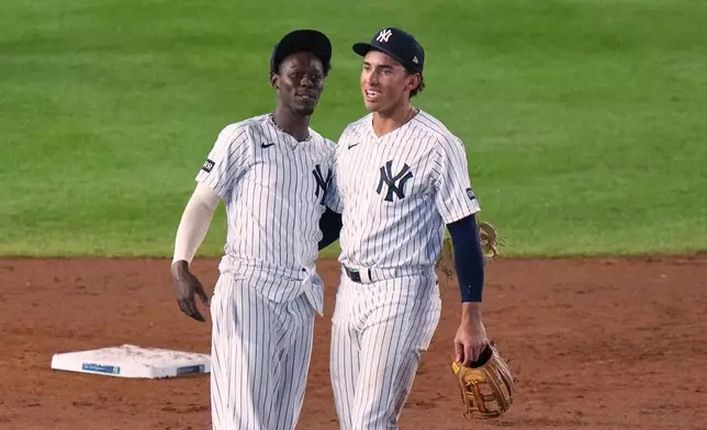 New York Yankees' Jazz Chisholm Jr., left, and George Lombard Jr. smile after a baseball game against the St. Louis Cardinals Tuesday, Aug. 4, 2026, in New York. (AP Photo/Frank Franklin II)