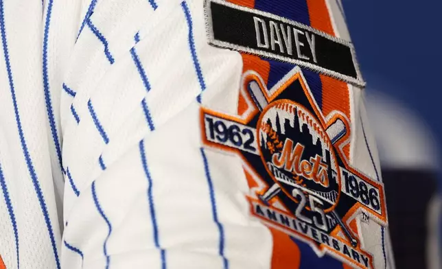 Sid Fernandez wears a tribute patch honoring manager Davey Johnson during a press conference with members of the 1986 New York Mets team that won a World Series, in New York, Saturday, Aug. 1, 2026. (AP Photo/Heather Khalifa)