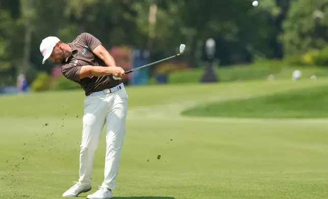 Wyndham Clark hits from the fourth fairway during the third round of the BMW Championship golf tournament Saturday, Aug. 22, 2026, in St. Louis. (AP Photo/Jeff Roberson)
