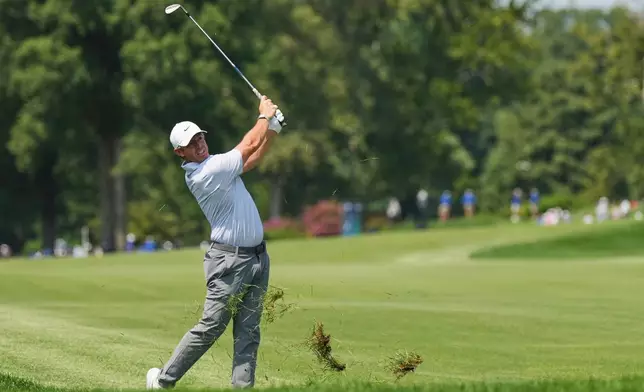 Rory McIlroy, of Northern Ireland, hits from the rough on the fourth hole during the third round of the BMW Championship golf tournament Saturday, Aug. 22, 2026, in St. Louis. (AP Photo/Jeff Roberson)