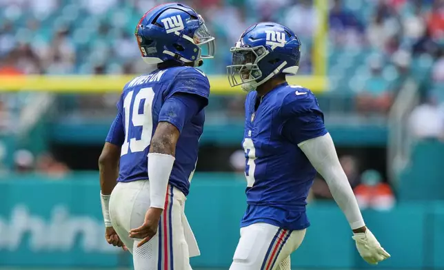 New York Giants quarterback Jameis Winston (19) celebrates with New York Giants wide receiver Odell Beckham Jr. (3) during the first half of a preseason NFL football game against the Miami Dolphins, Saturday, Aug. 22, 2026, in Miami Gardens, Fla. (AP Photo/Lynne Sladky)