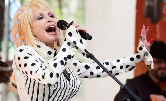 FILE - Dolly Parton performs on NBC's "Today" show in New York on May 13, 2014. (Photo by Charles Sykes/Invision/AP, File)
