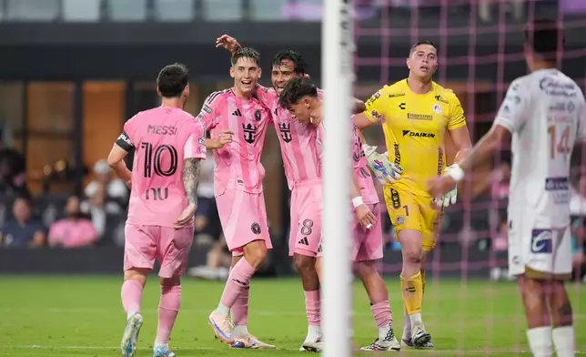 Inter Miami midfielder Telasco Segovia (8) celebrates with teammates after scoring his side's second goal past Atletico de San Luis goalkeeper Andres Sanchez (1) during the first half of a Leagues Cup soccer match, Wednesday, Aug. 5, 2026, in Miami. (AP Photo/Rebecca Blackwell)