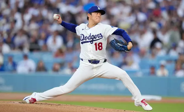 Los Angeles Dodgers starting pitcher Yoshinobu Yamamoto throws to the plate during the first inning of a baseball game against the Milwaukee Brewers, Friday, Aug. 14, 2026, in Los Angeles. (AP Photo/Mark J. Terrill)