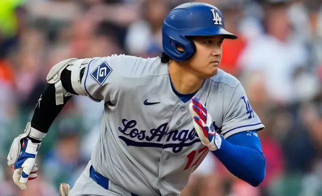 Los Angeles Dodgers' Shohei Ohtani runs out a ground out against the Detroit Tigers during the third inning of a baseball game Friday, Aug. 28, 2026, in Detroit. (AP Photo/Paul Sancya)