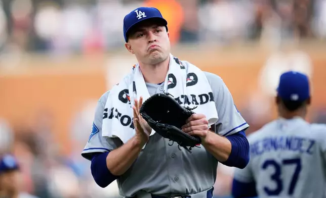 Los Angeles Dodgers pitcher Tarik Skubal claps as he walks to the dugout before the first inning of a baseball game against the Detroit Tigers Friday, Aug. 28, 2026, in Detroit. (AP Photo/Paul Sancya)