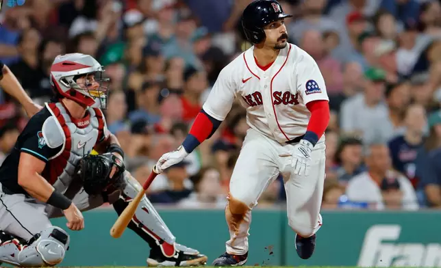 Arizona Diamondbacks catcher James McCann, left, and Boston Red Sox designated hitter Mickey Gasper, watch Gasper's solo home run during the sixth inning of a baseball game Tuesday, Aug. 18, 2026, in Boston. (AP Photo/CJ Gunther)