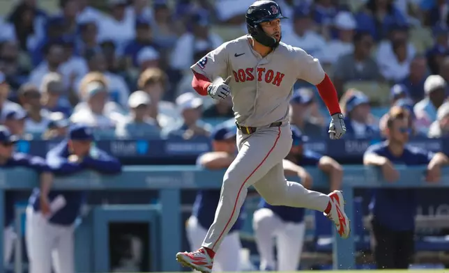 Boston Red Sox's Wilyer Abreu (52) runs home to score on a single hit by Boston Red Sox's Caleb Durbin during the first inning of a baseball game against the Los Angeles Dodgers, Sunday, Aug. 2, 2026, in Los Angeles. (AP Photo/Caroline Brehman)
