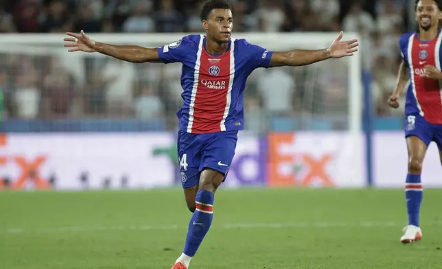 PSG's Desire Doue celebrates after scoring his side's second goal during the UEFA Super Cup soccer match between Paris Saint-Germain and Aston Villa in Salzburg, Austria, Wednesday, Aug. 12, 2026. (AP Photo/Heinz-Peter Bader)
