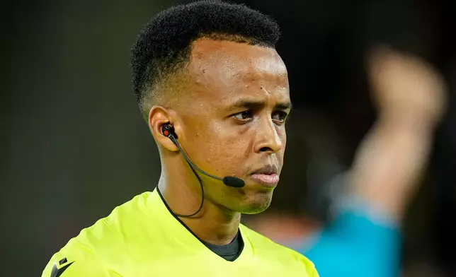 Referee Omar Artan waits for the start of the UEFA Super Cup soccer match between Paris Saint-Germain and Aston Villa in Salzburg, Austria, Wednesday, Aug.12, 2026. (AP Photo/Darko Bandic)