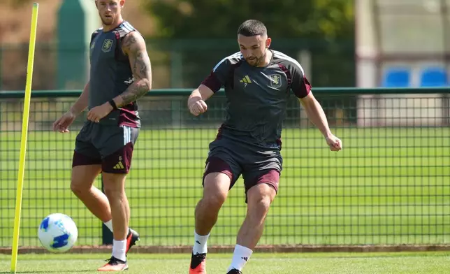 Aston Villa's John McGinn, right, and Ross Barkley attend a training session in Birmingham, England, Tuesday Aug. 11, 2026. (Nick Potts/PA via AP)