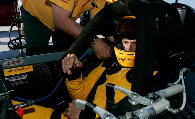 FILE - British driver Andy Green gets strapped into his seat before setting a new unofficial world diesel powered land speed record of over 328 mph over two runs Tuesday, Aug. 22, 2006, on the Bonneville Salt Flats of Utah. (AP Photo/Douglas C. Pizac,File)