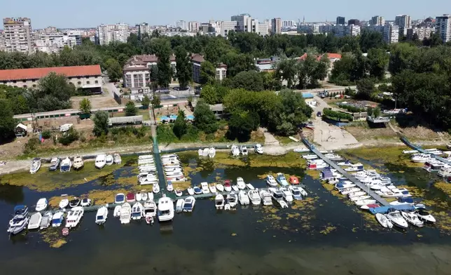 Boats sit on dry ground as water levels have dropped on the Danube River in Novi Sad, Serbia, Wednesday, July 29, 2026. (AP Photo/Darko Vojinovic)