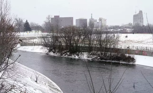 FILE = The Flint River flows Jan. 6, 2022, in Flint, Mich. (AP Photo/Carlos Osorio, File)