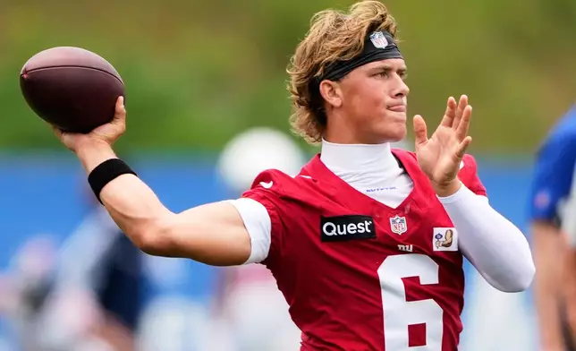 New York Giants quarterback Jaxson Dart practices during an NFL football training camp, Wednesday, July 29, 2026, in White Sulphur Springs, W.Va. (AP Photo/Chris Carlson)