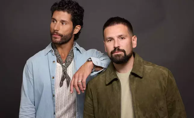 Dan Smyers, left, and Shay Mooney of Dan + Shay pose for a portrait on Thursday, July 30, 2026, in New York. (Photo by Matt Licari/Invision/AP)