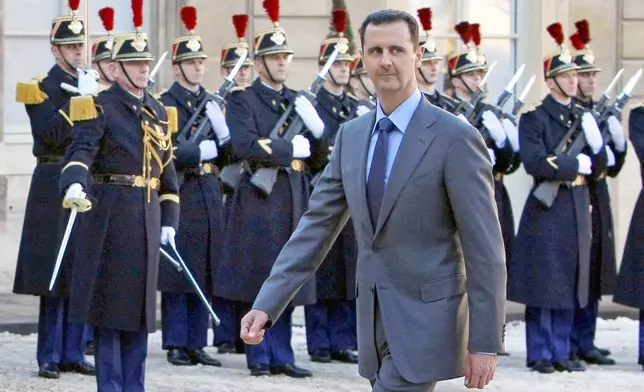 FILE - In this Dec. 9, 2010 file photo, Syria President Bashar al-Assad arrives at the Elysee Palace in Paris for his meeting with French President Nicolas Sarkozy. (AP Photo/Remy de la Mauviniere, File)