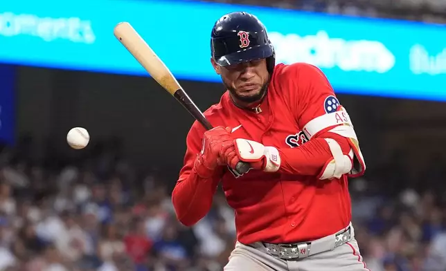 Boston Red Sox's Willson Contreras is hit by a pitch during the third inning of a baseball game against the Los Angeles Dodgers, Friday, July 31, 2026, in Los Angeles. (AP Photo/Mark J. Terrill)