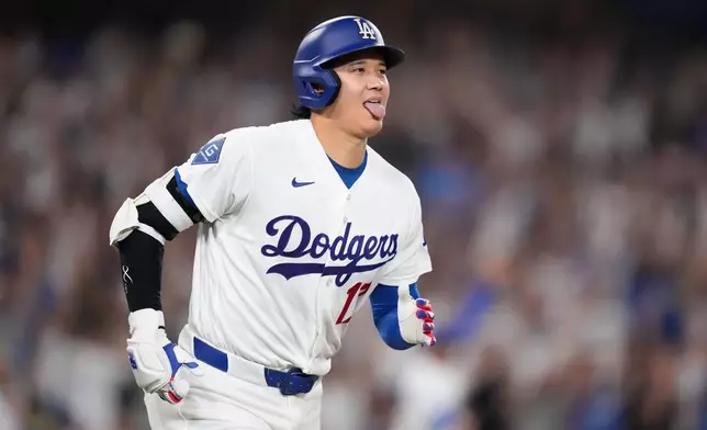 Los Angeles Dodgers' Shohei Ohtani heads to first for a two-run home run during the fifth inning of a baseball game against the Boston Red Sox, Friday, July 31, 2026, in Los Angeles. (AP Photo/Mark J. Terrill)