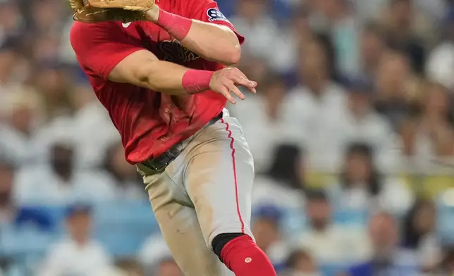 Boston Red Sox third baseman Caleb Durbin throws out Los Angeles Dodgers' Miguel Rojas at first during the seventh inning of a baseball game Friday, July 31, 2026, in Los Angeles. (AP Photo/Mark J. Terrill)