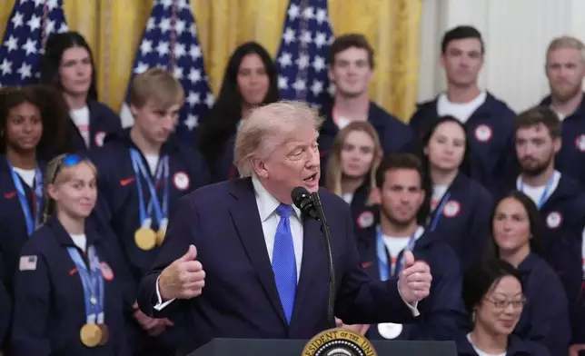 President Donald Trump speaks during an event for Olympic winter athletes, coaches, staff, and representatives from Team USA in the East Room of the White House, Thursday, Aug. 6, 2026, in Washington. (AP Photo/Alex Brandon)