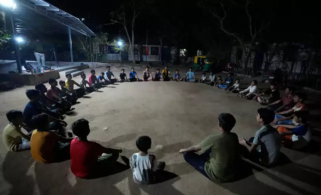FILE - Youths participate in a Hindu nationalist organisation Rashtriya Swayamsevak Sangh (RSS) shakha in Ahmedabad, India, April 8, 2024. Shakhas, or local units, induct boys by combining religious education with self-defense skills and games. (AP Photo/Ajit Solanki, File)
