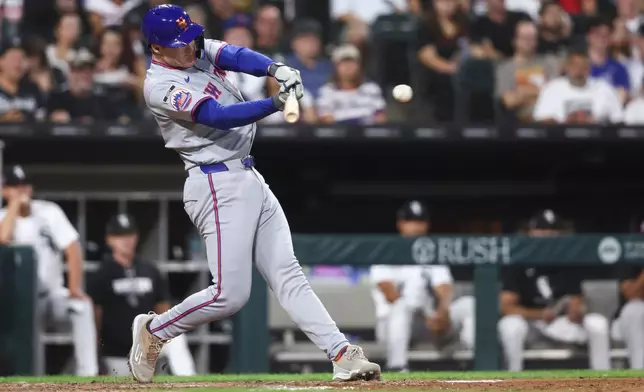 New York Mets' Eric Wagaman hits an RBI single during the fifth inning of a baseball game against the Chicago White Sox in Chicago, Saturday, Aug. 22, 2026. (AP Photo/Jessie Alcheh)