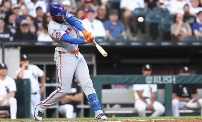 New York Mets' Luis Robert Jr. hits a home run during the third inning of a baseball game against the Chicago White Sox in Chicago, Saturday, Aug. 22, 2026. (AP Photo/Jessie Alcheh)
