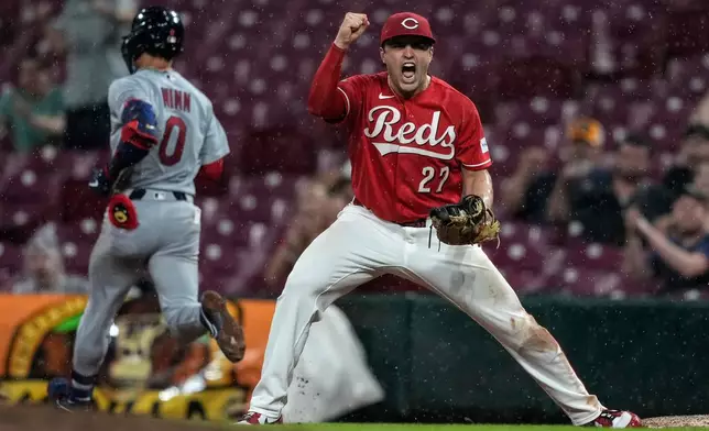 Cincinnati Reds first baseman Sal Stewart (27) reacts as St. Louis Cardinals' Masyn Winn (0) is out at first base after grounding out softly to pitcher Emilio Pagán in the ninth inning to win a baseball game between the Cincinnati Reds and the St. Louis Cardinals, Wednesday, Aug. 19, 2026, in Cincinnati. (AP Photo/Carolyn Kaster)