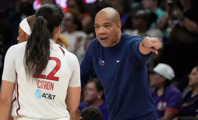 Washington Mystics head coach Sydney Johnson, right, talks with Mystics guard Sonia Citron during the first half of a WNBA basketball game against the Phoenix Mercury, Thursday, Aug. 27, 2026, in Phoenix. (AP Photo/Ross D. Franklin)