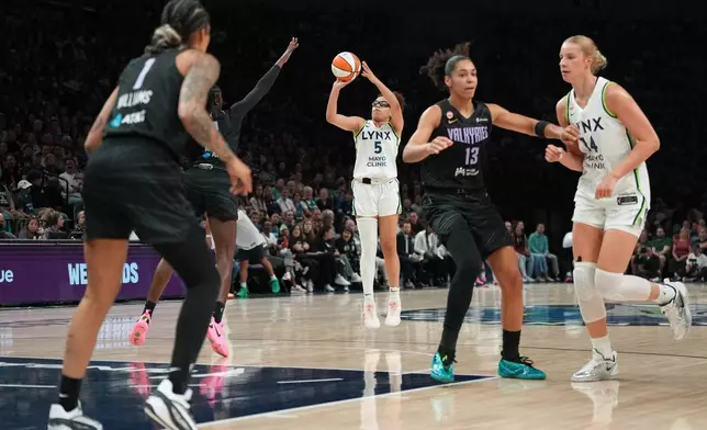 Minnesota Lynx guard Olivia Miles (5) goes up to shoot during the first half of a WNBA basketball game against the Golden State Valkyries, Monday, Aug. 24, 2026, in Minneapolis. (AP Photo/Abbie Parr)