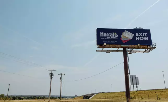 A billboard for Harrah's Casino on Route 66 is seen near Chandler, Okla., Wednesday, Aug. 5, 2026. (AP Photo/Brittany Bendabout)