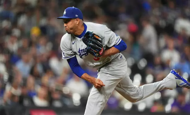Los Angeles Dodgers relief pitcher Edwin DÌaz works against the Colorado Rockies in the ninth inning of a baseball game Monday, Aug. 17, 2026, in Denver. (AP Photo/David Zalubowski)