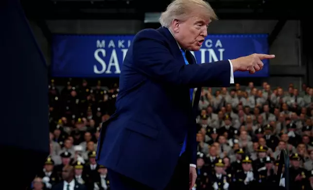 President Donald Trump arrives to speak at the David Mack Center for Training and Intelligence, Friday, Aug. 14, 2026, in Garden City, N.Y. (AP Photo/Julia Demaree Nikhinson)