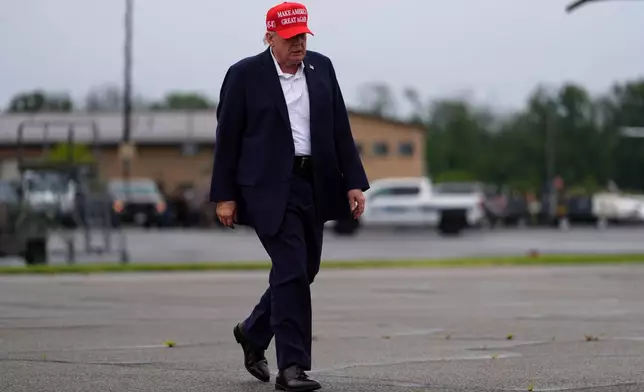 President Donald Trump walks to board Air Force One at Morristown Airport, Sunday, Aug. 16, 2026, in Morristown, N.J. (AP Photo/Julia Demaree Nikhinson)