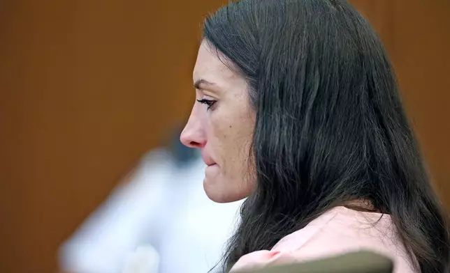 Defendant Lindsay Clancy listens to Dr. Jennifer Tufts on the witness stand during her murder trial at Plymouth Superior Court in Plymouth, Mass., Monday, Aug. 10, 2026. (Greg Derr/The Patriot Ledger via AP, Pool)