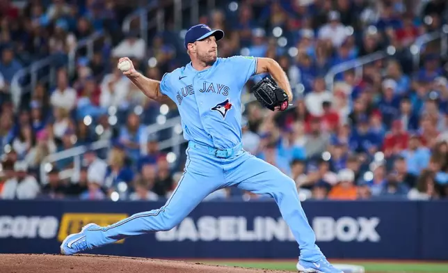 Toronto Blue Jays' Max Scherzer works against the St. Louis Cardinals during the first inning of a baseball game in Toronto, Sunday, Aug. 2, 2026. (Sammy Kogan/The Canadian Press via AP)