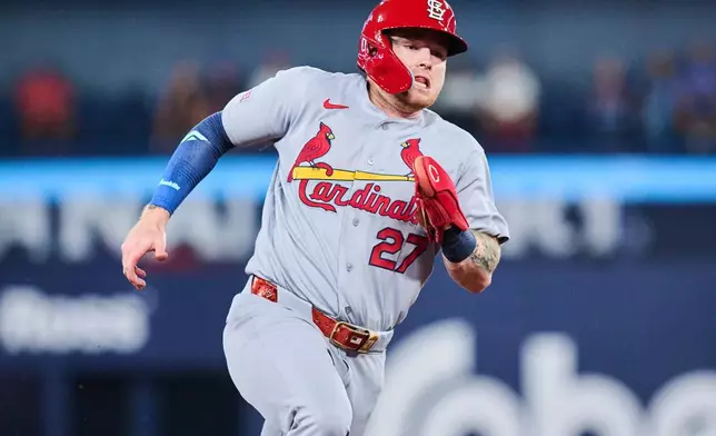 St. Louis Cardinals' Nathan Church sprints in to score on a double by Lars Nootbaar during the third inning of a baseball game against the Toronto Blue Jays in Toronto, Sunday, Aug. 2, 2026. (Sammy Kogan/The Canadian Press via AP)