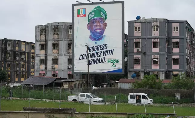 A giant poster of Nigerian incumbent president, Bola Tinubu, of the All Progressives Congress Party is seen on a building in Lagos, Nigeria, Tuesday, Aug. 18, 2026. (AP Photo/Sunday Alamba)