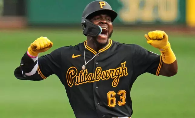 Pittsburgh Pirates' Ronny Simon celebrates after driving in two runs with a double off New York Mets pitcher Robert Stock during the first inning of a baseball game in Pittsburgh, Saturday, Aug. 8, 2026. (AP Photo/Gene J. Puskar)