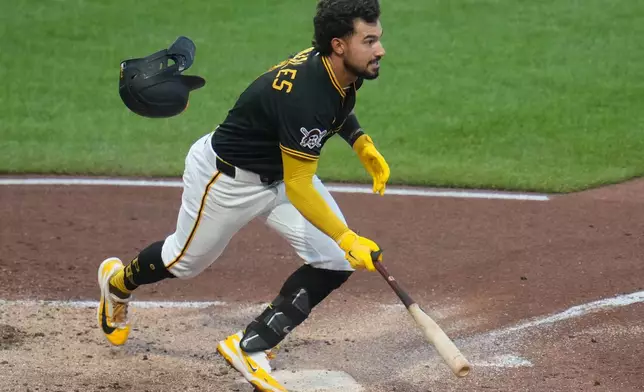 Pittsburgh Pirates' Nick Gonzales hits a double with bases loaded off New York Mets pitcher Robert Stock, driving in two runs, during the fourth inning of a baseball game in Pittsburgh, Saturday, Aug. 8, 2026. (AP Photo/Gene J. Puskar)