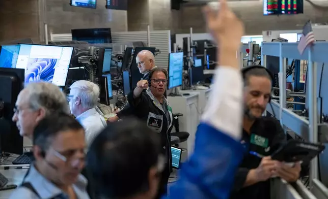 Options trader Anthony Spina works on the floor of the New York Stock Exchange, Monday, Aug. 17, 2026, in New York. (AP Photo/Yuki Iwamura)